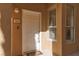Close-up of a white front door with visible house number and sidelight at 1609 Hills Of Red Dr # 104, Las Vegas, NV 89128