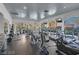 Community gym featuring modern equipment, large windows with neighborhood views, and mirrored walls at 1609 Hills Of Red Dr # 104, Las Vegas, NV 89128