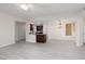 Inviting living room with an open layout, a fireplace, and a kitchen view at 1609 Hills Of Red Dr # 104, Las Vegas, NV 89128
