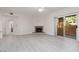 Spacious living room with sliding glass doors and a marble fireplace at 1609 Hills Of Red Dr # 104, Las Vegas, NV 89128