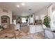 Open-concept living area with tile floors, fireplace, and ample natural light at 1609 Hills Of Red Dr # 104, Las Vegas, NV 89128