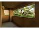 A tranquil patio space with a scenic view of lush landscaping and mature trees at 1609 Hills Of Red Dr # 104, Las Vegas, NV 89128