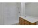 Bathroom featuring a walk in shower, sink, and wooden vanity at 1830 N Buffalo Dr # 2024, Las Vegas, NV 89128