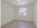 Bedroom featuring gray wood flooring and a window at 1830 N Buffalo Dr # 2024, Las Vegas, NV 89128