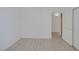 Well-lit bedroom features wood-look flooring and closet at 1830 N Buffalo Dr # 2024, Las Vegas, NV 89128