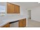 Cozy kitchen showcasing stainless appliances, wooden cabinets, and a corner sink at 1830 N Buffalo Dr # 2024, Las Vegas, NV 89128
