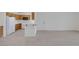Bright living area with wood-look floors, an open layout, and views into the kitchen at 1830 N Buffalo Dr # 2024, Las Vegas, NV 89128
