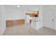 Inviting living space featuring wood-look floors, recessed lighting, and an open flow to the kitchen at 1830 N Buffalo Dr # 2024, Las Vegas, NV 89128
