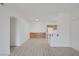 Light-filled living area with wood-look floors, neutral walls, and seamless access to the kitchen at 1830 N Buffalo Dr # 2024, Las Vegas, NV 89128