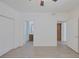 Main bedroom featuring gray wood floors and doors to the bathroom and closet at 1830 N Buffalo Dr # 2024, Las Vegas, NV 89128
