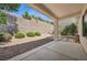 Covered patio with landscaped yard and rock groundcover at 2026 Wildwood Lake St, Henderson, NV 89052