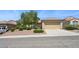 Charming single-story home featuring a well-maintained front yard with desert landscaping at 2026 Wildwood Lake St, Henderson, NV 89052