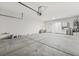 Well-lit garage interior showing an open layout with work sink and door at 2026 Wildwood Lake St, Henderson, NV 89052