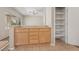 Open kitchen with wood cabinets and pantry storage at 2026 Wildwood Lake St, Henderson, NV 89052