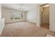 Spacious living room with carpet and natural light through a large window at 2026 Wildwood Lake St, Henderson, NV 89052