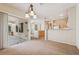 Bright living area with sliding glass doors leading to patio and open flow to the kitchen at 2026 Wildwood Lake St, Henderson, NV 89052