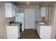 Bright kitchen featuring white cabinets, updated appliances, and tile flooring, creating a modern cooking space at 2120 Ramrod Ave # 417, Henderson, NV 89014