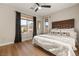 Bright primary bedroom featuring mountain views, ceiling fan and natural light at 258 Castellari Dr, Las Vegas, NV 89138