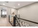 Second floor hallway with modern railing and light walls, bright modern aesthetic at 258 Castellari Dr, Las Vegas, NV 89138