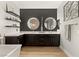 Stunning main bathroom features dual vanities with unique lighting, floating shelves, and modern finishes at 258 Castellari Dr, Las Vegas, NV 89138