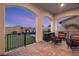 Charming outdoor patio with ample seating and access to the beautifully landscaped backyard at 258 Castellari Dr, Las Vegas, NV 89138