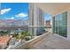 A spacious balcony with clear railings offers city views from this high-rise condominium at 2777 Paradise Rd # 1002, Las Vegas, NV 89109