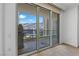 Open-air balcony through a glass sliding door features neutral walls, tile floors, and city views at 2777 Paradise Rd # 1002, Las Vegas, NV 89109
