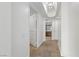 Hallway with tile flooring leads to a brightly lit bathroom and other rooms at 2777 Paradise Rd # 1002, Las Vegas, NV 89109