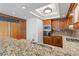 Kitchen with recessed lighting, granite countertops, stainless steel sink, and custom cabinets provide functionality and style at 2777 Paradise Rd # 1002, Las Vegas, NV 89109