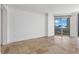 Bright living room featuring recessed lighting, neutral walls, tile floor, and city views from the glass sliding doors at 2777 Paradise Rd # 1002, Las Vegas, NV 89109