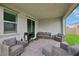 Stylish covered patio with outdoor seating, a grill, and views of the well-maintained backyard at 3024 River Brook Ct, Las Vegas, NV 89139
