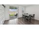 Dining area featuring a sliding glass door with views of the backyard and patio at 3024 River Brook Ct, Las Vegas, NV 89139