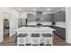 Spacious kitchen with an island, stainless steel appliances, and gray cabinets at 3024 River Brook Ct, Las Vegas, NV 89139