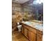 Bathroom featuring a double sink vanity with stone countertops and tiled walls at 3320 S Fort Apache Rd # 139, Las Vegas, NV 89117