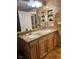 Bathroom featuring a double sink vanity with stone countertops and tiled walls at 3320 S Fort Apache Rd # 139, Las Vegas, NV 89117
