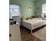 Cozy bedroom features a large window, hardwood floors, and a comfortable bed adorned with stuffed animals at 3320 S Fort Apache Rd # 139, Las Vegas, NV 89117