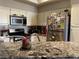 Charming kitchen featuring stone countertops, stainless appliances, and white cabinets at 3320 S Fort Apache Rd # 139, Las Vegas, NV 89117