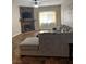 Cozy living room with stone fireplace, ceiling fan and a comfortable sectional at 3320 S Fort Apache Rd # 139, Las Vegas, NV 89117