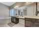 Bathroom with dual sink vanity, walk-in shower, and separate soaking tub at 334 Cougar Estates Ln, Las Vegas, NV 89123