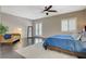 Spacious main bedroom featuring a ceiling fan, private patio access, and modern window shutters at 334 Cougar Estates Ln, Las Vegas, NV 89123