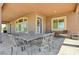 Covered patio featuring ample seating and outdoor dining area at 334 Cougar Estates Ln, Las Vegas, NV 89123
