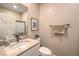 Bright bathroom features a vanity sink, tile floors, and walk-in shower at 3778 Via Gennaro, Henderson, NV 89044