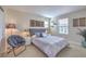 Comfortable bedroom featuring carpet floors and large windows, creating a relaxing living space at 3778 Via Gennaro, Henderson, NV 89044