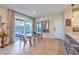 Dining area with sliding glass doors and modern furnishings, perfect for entertaining at 3778 Via Gennaro, Henderson, NV 89044