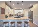 Beautiful kitchen features granite countertops, a breakfast bar with seating, and stainless steel appliances at 3778 Via Gennaro, Henderson, NV 89044