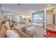 Bright living area featuring hardwood floors, modern décor, and an open flow to the kitchen at 3778 Via Gennaro, Henderson, NV 89044