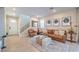 Bright living room with hardwood floors, comfortable seating, and access to the staircase at 3778 Via Gennaro, Henderson, NV 89044
