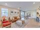 Open-concept living area with wood floors, modern furniture, and ample natural light at 3778 Via Gennaro, Henderson, NV 89044