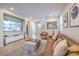 Inviting living room featuring hardwood floors, neutral colors, and an open-concept design at 3778 Via Gennaro, Henderson, NV 89044