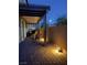 Charming outdoor patio featuring a brick floor, stylish pergola, and tasteful lighting for serene evenings at 3778 Via Gennaro, Henderson, NV 89044